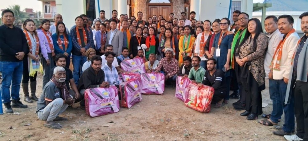 Nagaland state BJP officials with Khermahal fire victims during distribution of relief materials on January 16.
